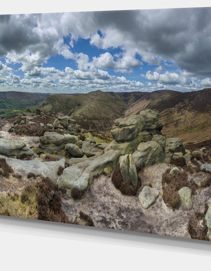DesignQ Clouds And Stones Under Wild Clouds - Landscape Artwork Canvas