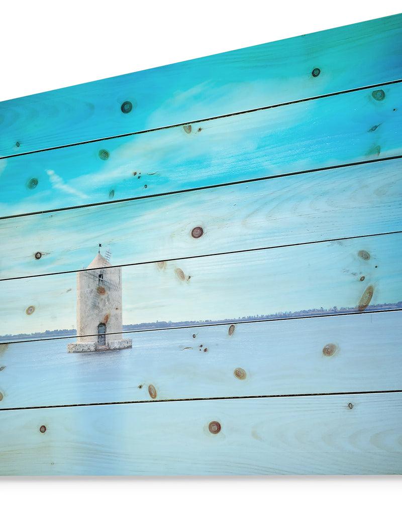 DesignQ Old Spanish Windmill In Blue Lagoon - Seashore Print On Natural Pine Wood