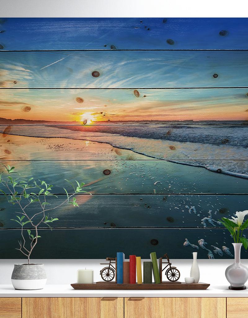 DesignQ Blue Seashore with Distant Sunset - Seascape Print on Natural Pine Wood