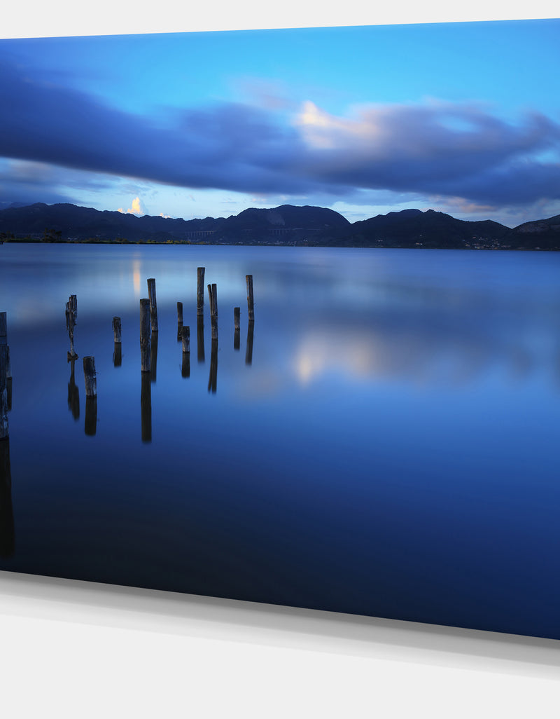 DesignQ Dark Blue Sea With Pier Remains - Seascape Photo Canvas Print