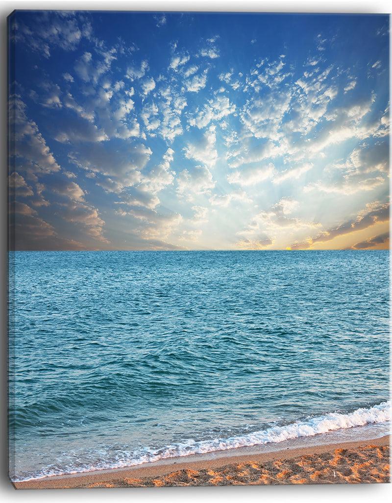 DesignQ Fasting Moving Clouds Over Blue Beach - Modern Beach Canvas Art Print