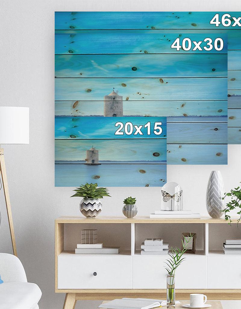 DesignQ Old Spanish Windmill In Blue Lagoon - Seashore Print On Natural Pine Wood