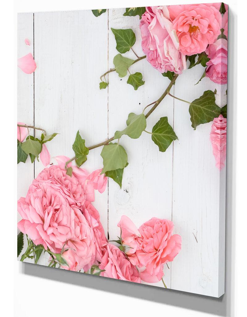 DesignQ Pink Roses Facing Lying On Wood - Floral Photography On Wrapped Canvas