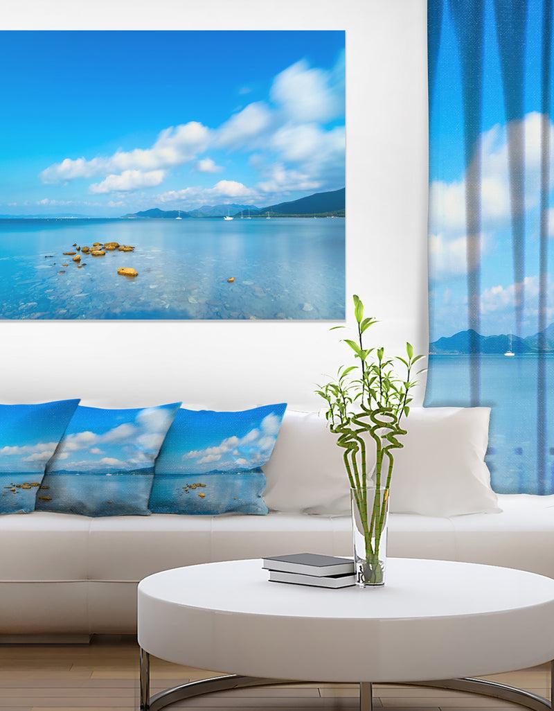 DesignQ Rocks in a Blue Panoramic Sea Bay - Extra Large Seashore Canvas Art