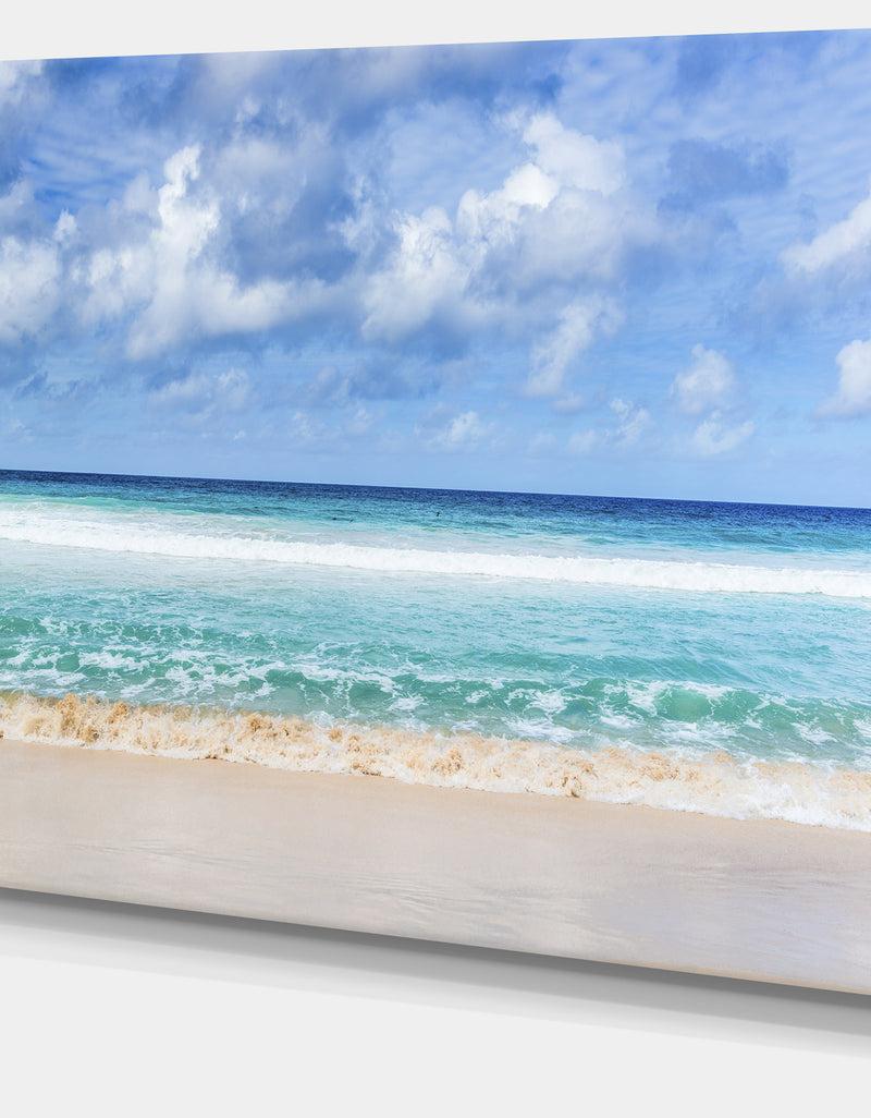 DesignQ Tranquil Beach Under White Clouds - Modern Seascape Canvas Artwork