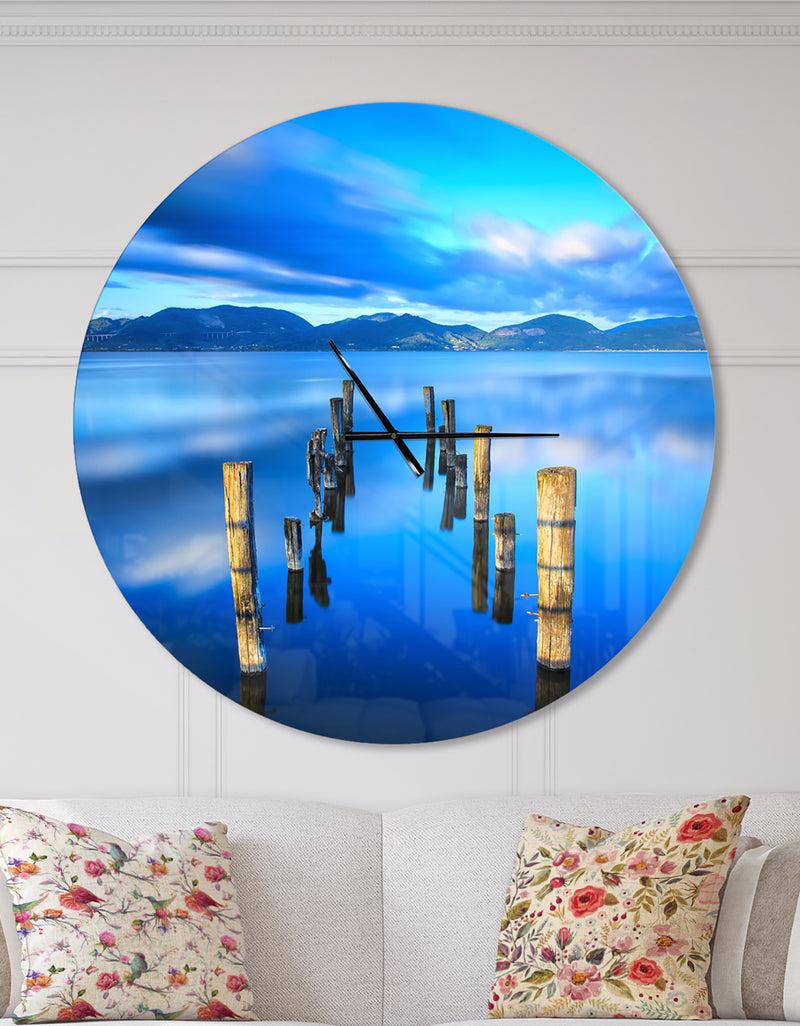 DesignQ Wooden Pier Remains in Blue Sea - Large Coastal Wall CLock
